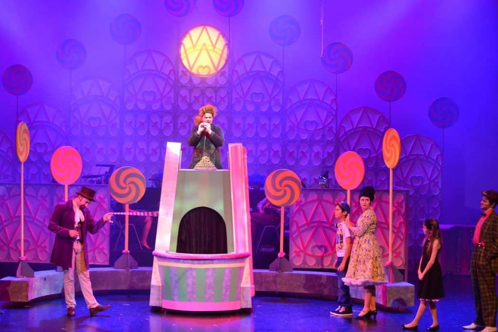 Willie Wonka production in Dubai, UAE. The kids enter part of Wonka's factory. Depicted with large candy sweets on stage.